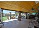 Outdoor patio with wood ceiling and a view of the backyard and pool at 3802 W Kelton Ln, Phoenix, AZ 85053