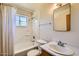 Bright bathroom with a shower/tub combo, single sink vanity, and ample lighting to enjoy at 3944 E Oak St, Phoenix, AZ 85008