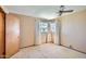 A cozy bedroom is lit with natural light and a ceiling fan, perfect for relaxing and unwinding at 3944 E Oak St, Phoenix, AZ 85008