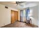 This bedroom has a sliding closet, ceiling fan, natural light and neutral tones, perfect for relaxing at 3944 E Oak St, Phoenix, AZ 85008