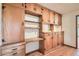 Charming built-in cabinets with desk and shelving provides ample storage in the residence at 3944 E Oak St, Phoenix, AZ 85008