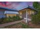 Charming single-story home featuring a covered porch, tidy landscaping, and an inviting entryway at 3944 E Oak St, Phoenix, AZ 85008