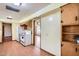 Well-lit kitchen featuring white appliances, wood cabinets, and wood laminate flooring at 3944 E Oak St, Phoenix, AZ 85008