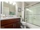 Clean bathroom featuring a wood vanity, framed mirror, a shower-tub combination, and neutral paint at 4137 E Stanford Ave, Gilbert, AZ 85234