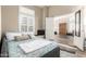 Inviting bedroom with an open doorway, platform bed, neutral walls, and a window with shutter blinds at 4137 E Stanford Ave, Gilbert, AZ 85234