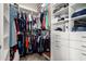 Organized walk-in closet with built-in shelving, drawers, and ample hanging space for clothes and accessories at 4137 E Stanford Ave, Gilbert, AZ 85234