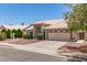 Inviting single-story home with a neutral color scheme and desert-friendly landscaping at 4137 E Stanford Ave, Gilbert, AZ 85234