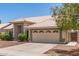 Inviting single-story home with a neutral color scheme and desert-friendly landscaping at 4137 E Stanford Ave, Gilbert, AZ 85234