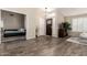 Bright and airy living room featuring hardwood floors, a high ceiling, and ample natural light at 4137 E Stanford Ave, Gilbert, AZ 85234