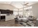 Open-concept living room featuring hardwood floors, high ceilings, and comfortable seating at 4137 E Stanford Ave, Gilbert, AZ 85234