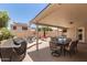 Inviting covered patio with grill, dining set and lounge area overlooking the refreshing pool at 4137 E Stanford Ave, Gilbert, AZ 85234