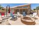 Charming patio with fire pit and Adirondack chairs, perfect for outdoor relaxation and entertainment at 4137 E Stanford Ave, Gilbert, AZ 85234