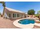 The beautiful backyard features a refreshing pool and covered patio, great for entertaining guests at 4137 E Stanford Ave, Gilbert, AZ 85234