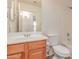 Bathroom featuring wood cabinets, and a shower and tub combo at 42551 W Anne Ln, Maricopa, AZ 85138