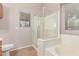 Bathroom featuring tile flooring, a shower, and a large bathtub at 42551 W Anne Ln, Maricopa, AZ 85138