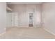 Spacious bedroom featuring neutral carpet, ample natural light and two closets at 42551 W Anne Ln, Maricopa, AZ 85138