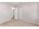 Bedroom with neutral walls and carpets, closet and bathroom access at 42551 W Anne Ln, Maricopa, AZ 85138