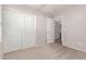 Bedroom with neutral walls and carpets, closet and bathroom access at 42551 W Anne Ln, Maricopa, AZ 85138