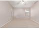 Bedroom with neutral carpet, light walls, ceiling fan and window with blinds at 42551 W Anne Ln, Maricopa, AZ 85138