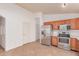Spacious kitchen features stainless steel appliances and tile flooring at 42551 W Anne Ln, Maricopa, AZ 85138