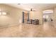 Inviting living area featuring tile flooring, neutral walls and comfortable seating at 44517 W Copper Trl, Maricopa, AZ 85139
