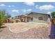 Expansive backyard space with a covered patio and drought tolerant landscaping, perfect for outdoor entertaining at 45391 W Portabello Rd, Maricopa, AZ 85139