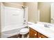 Full bathroom with a tub-shower combo, white fixtures, vanity, and tile flooring at 45391 W Portabello Rd, Maricopa, AZ 85139