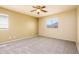 Comfortable bedroom with neutral walls, carpet flooring, and bright windows at 45391 W Portabello Rd, Maricopa, AZ 85139