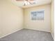 Standard bedroom featuring neutral walls, carpet flooring, and good lighting at 45391 W Portabello Rd, Maricopa, AZ 85139