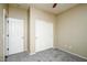 Comfortable bedroom with carpet flooring, a ceiling fan, and a closet at 45391 W Portabello Rd, Maricopa, AZ 85139