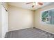 Cozy bedroom featuring neutral walls, carpet flooring, closet space, and ample natural light at 45391 W Portabello Rd, Maricopa, AZ 85139