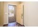 Interior view of a front door with a security screen and decorative marble tile flooring at 45391 W Portabello Rd, Maricopa, AZ 85139