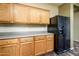 Kitchen with oak cabinets, modern appliances, and ample counter space at 45391 W Portabello Rd, Maricopa, AZ 85139