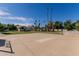 The backyard features a large concrete area with palm trees around the perimeter at 5237 N 106Th Ave, Glendale, AZ 85307