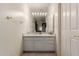 Well-lit bathroom with a large mirror, granite countertop, and updated fixtures at 5237 N 106Th Ave, Glendale, AZ 85307