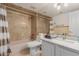 The bathroom features a shower and bath, mirror, toilet, and sink with granite counters at 5237 N 106Th Ave, Glendale, AZ 85307