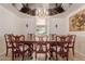 Elegant dining room with mirrored ceiling, chandelier, and formal dining set at 5237 N 106Th Ave, Glendale, AZ 85307