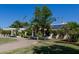 Beautiful landscaping and trees surround this home with solar panels at 5237 N 106Th Ave, Glendale, AZ 85307