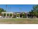 Exterior elevation of the front of the home with green grass and solar panels at 5237 N 106Th Ave, Glendale, AZ 85307