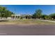 Well maintained front yard with mature trees and green grass at 5237 N 106Th Ave, Glendale, AZ 85307