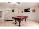 Game room with pool table, flat screen TV, and comfortable seating for entertaining guests at 5237 N 106Th Ave, Glendale, AZ 85307