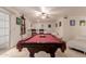 Game room featuring a pool table, wet bar, and seating area with sliding doors for ample lighting at 5237 N 106Th Ave, Glendale, AZ 85307