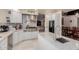 Bright kitchen with stainless steel appliances, white cabinets, and marble countertops at 5237 N 106Th Ave, Glendale, AZ 85307