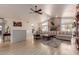 Bright living room featuring a brick fireplace, vaulted ceilings, and large windows at 5237 N 106Th Ave, Glendale, AZ 85307