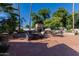 Spacious tiled patio featuring an outdoor kitchen and fireplace, great for entertaining and enjoying the backyard at 5237 N 106Th Ave, Glendale, AZ 85307