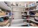Walk-in pantry with ample shelving for organized storage of food and kitchen essentials at 5237 N 106Th Ave, Glendale, AZ 85307
