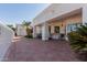 Spacious patio with classic tile flooring, offering a serene outdoor living space and mature landscaping at 5237 N 106Th Ave, Glendale, AZ 85307