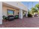 Relaxing covered patio with comfortable seating and classic tile flooring, great for entertaining at 5237 N 106Th Ave, Glendale, AZ 85307