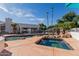 Beautiful outdoor pool and spa area surrounded by mature trees and professional landscaping at 5237 N 106Th Ave, Glendale, AZ 85307