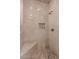 Modern tiled shower with a built-in niche and sleek fixtures at 5237 N 106Th Ave, Glendale, AZ 85307
